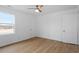 Another bedroom with light wood floors and natural light at 2001 Rolesville Rd, Wake Forest, NC 27587
