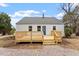 Exterior of home featuring a deck, manicured lawn, and gravel at 2001 Rolesville Rd, Wake Forest, NC 27587