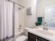 Bathroom boasts a shower-tub combo with a shower curtain, toilet, and vanity at 2027 October Dr, Durham, NC 27703