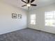 Bedroom features two bright windows, carpet and white walls at 2027 October Dr, Durham, NC 27703