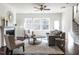 Inviting living room with a fireplace, hardwood floors, and an open layout at 2027 October Dr, Durham, NC 27703