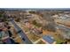 An aerial view of single Gathering homes and a tree lined street on a sunny day at 206 Eastway Ln, Graham, NC 27253