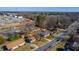 An aerial view of a residential neighborhood and light industrial area on a sunny day at 206 Eastway Ln, Graham, NC 27253