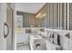 Clean bathroom featuring a tiled shower, toilet, and sink at 206 Eastway Ln, Graham, NC 27253