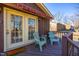 Charming deck area featuring comfortable seating and French doors, ideal for enjoying the outdoors at 206 Eastway Ln, Graham, NC 27253