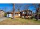 Charming two-story home with a brick facade, a garage, and a well-maintained front lawn at 206 Eastway Ln, Graham, NC 27253
