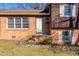 Close-up of the front entrance showcasing the brick facade, small porch, and neat landscaping at 206 Eastway Ln, Graham, NC 27253
