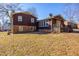 Backyard with a deck and brick and wood exterior at 206 Eastway Ln, Graham, NC 27253