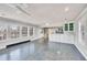 Open living space featuring tile floors, great natural light, and partial kitchen view at 206 Eastway Ln, Graham, NC 27253