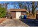 View of backyard shed and trash bins at 206 Eastway Ln, Graham, NC 27253