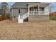 Exterior of home with a large deck and stairs leading down to the yard at 216 Cross St, Sanford, NC 27330