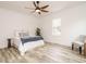 Bright bedroom featuring modern furniture, hardwood floors, and natural light at 216 Cross St, Sanford, NC 27330