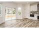 Bright kitchen area with stainless steel appliances and sliding glass doors to the patio at 216 Cross St, Sanford, NC 27330