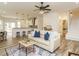 Cozy living room with luxury vinyl flooring, open to the kitchen, with natural light and a neutral color palette at 216 Cross St, Sanford, NC 27330