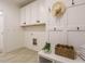 Mudroom features built-in cabinets, coat hooks and bench seating with natural light at 216 Cross St, Sanford, NC 27330