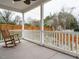 Covered porch with rocking chairs and a view of the backyard at 216 Cross St, Sanford, NC 27330