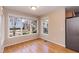 The dining area has hardwood floors and natural light from several windows at 2312 Knollwood Dr, Sanford, NC 27330