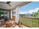 This screened porch offers outdoor seating and views of the grassy backyard and neighborhood homes at 236 Artisan Park Dr, Wake Forest, NC 27587