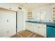 New kitchen with white cabinets, blue granite counters, and modern sink fixture with natural light at 2484 Michelle Dr, Burlington, NC 27217