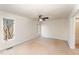 Spacious bedroom features neutral carpet, a ceiling fan, and two bright picture windows at 25 Sandstone Ridge Dr, Durham, NC 27713