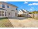 Expansive backyard with concrete patio and fenced perimeter at 2506 Pepperstone Dr, Graham, NC 27253