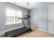 Bedroom with a treadmill and lots of natural light from the window at 2506 Pepperstone Dr, Graham, NC 27253