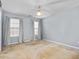 Spacious bedroom with fan, carpet, and large windows for ample light at 2506 Pepperstone Dr, Graham, NC 27253
