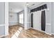 Inviting entryway featuring beautiful wood-look floors and a modern chandelier at 2506 Pepperstone Dr, Graham, NC 27253