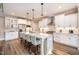 Kitchen featuring white cabinetry, granite countertops, stainless steel appliances, and a center island with bar stool seating at 2941 Mt Vernon Church Rd, Raleigh, NC 27613