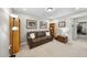 Comfortable bonus room with a sofa, shelving, and decor at 312 Princess Pl, Morrisville, NC 27560