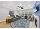 Relaxing living room with hardwood floors, lots of natural light, and comfortable seating at 312 Princess Pl, Morrisville, NC 27560