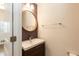 Bathroom featuring a modern vanity with a vessel sink and a round mirror at 3836 Prince Noah Loop, Wake Forest, NC 27587