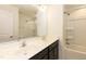 Bathroom with double sinks, a spacious vanity, a shower with tub, and ample lighting at 3836 Prince Noah Loop, Wake Forest, NC 27587