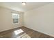 Bright bedroom featuring a large window and stylish and light-colored flooring at 3836 Prince Noah Loop, Wake Forest, NC 27587