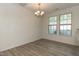 Open dining area with natural light and modern chandelier at 3836 Prince Noah Loop, Wake Forest, NC 27587