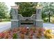 Stonegate neighborhood entrance sign adorned with stone pillars, landscaping and lush greenery at 3836 Prince Noah Loop, Wake Forest, NC 27587