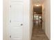 Bright hallway featuring wood-look flooring and white trim at 3836 Prince Noah Loop, Wake Forest, NC 27587