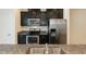 Close-up of kitchen with granite counters and stainless steel appliances at 3836 Prince Noah Loop, Wake Forest, NC 27587