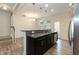 Open kitchen with granite countertops and stainless steel appliances at 3836 Prince Noah Loop, Wake Forest, NC 27587