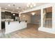 A modern living room with hardwood floors and white walls is bright, welcoming and open concept at 3836 Prince Noah Loop, Wake Forest, NC 27587
