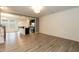Open concept living room and kitchen with stainless steel appliances and breakfast bar at 3836 Prince Noah Loop, Wake Forest, NC 27587