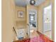 Inviting hallway with hardwood flooring, with a view into the Primary bedroom and bathroom at 3929 Browning Pl, Raleigh, NC 27609
