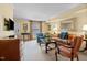 Bright living room featuring wood floors and neutral carpet, decorative artwork and comfortable seating at 3929 Browning Pl, Raleigh, NC 27609