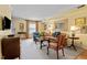 Bright living room featuring wood floors and neutral carpet, decorative artwork and comfortable seating at 3929 Browning Pl, Raleigh, NC 27609