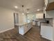 Bright kitchen features granite countertops, an island and stainless steel appliances at 3943 Baileys Xrds Rd, Benson, NC 27504