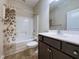 Bathroom with a shower-tub combo, a butterfly-themed shower curtain, and vanity at 3947 Foxglove Trl, Burlington, NC 27215