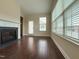 Living room featuring a fireplace and hardwood floors at 3947 Foxglove Trl, Burlington, NC 27215