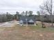 Gray home with a covered front porch and well maintained lawn on an oversized lot at 3958 Buckhorn Rd, Sanford, NC 27330
