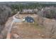 View of beautiful acreage with a gray home and outbuildings at 3958 Buckhorn Rd, Sanford, NC 27330