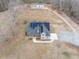 Inviting home featuring solar panels, a front porch, and a well-manicured lawn at 3958 Buckhorn Rd, Sanford, NC 27330